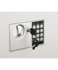 Front view of hidden in-wall safe with keypad and two manual override keys, suitable for home or office valuables storage.