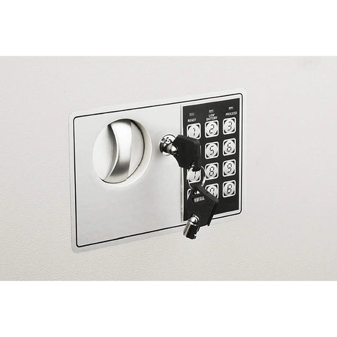 Front view of hidden in-wall safe with keypad and two manual override keys, suitable for home or office valuables storage.