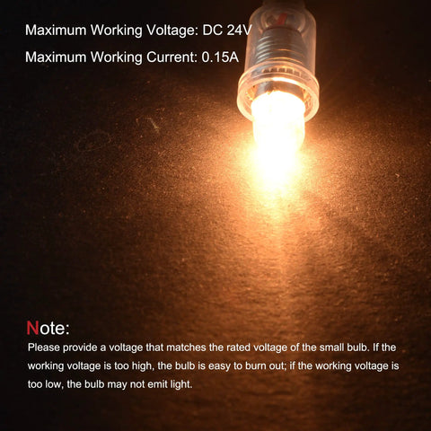 Tough As Nails E10 Screw Base Miniature Bulbs In Warm Yellow for DC 24V systems illuminated on a dark surface.