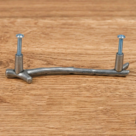10 Pack Zinc Alloy Twig Branch Cabinet Knob Set In Silver Decorative Pull Handles for cabinets with screws, wood background.