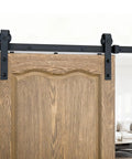 Upgrade Your Digs With This 6.6 Ft Black Sliding Barn Door Hardware Kit close-up of black rail and wooden door, perfect for interior use.