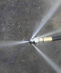 7 Pack 4000 PSI Sewer Jetter Nozzle Kit With Rotating Button Nose spraying water for pressure washer drain cleaning