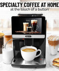 Fully Automatic Espresso Machine With Built In Conical Grinder And Auto Foaming Milk Wand brewing coffee in white cup with milk.