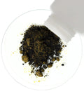 Anhydrous Ferric Chloride Powder 99.9% ACS Reagent Grade FeCl3 being poured onto a surface from a bottle, fine dry powder for etching