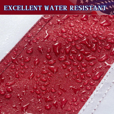 Close-up of Tough As Nails 3x5 Ft Outdoor US Flag with water droplets on red stripe, tearproof polyester, heavy duty sewn stripes.