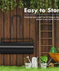 Heavy Duty Lawn Roller 17 Gallons Water Filled Sod Roller With Steel Drum And Ergonomic Handle hanging on wall in garden