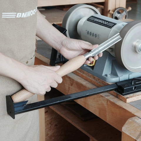 BG-GRIND4 four-piece grinding jig set close-up sharpening wood chisels on a bench grinder