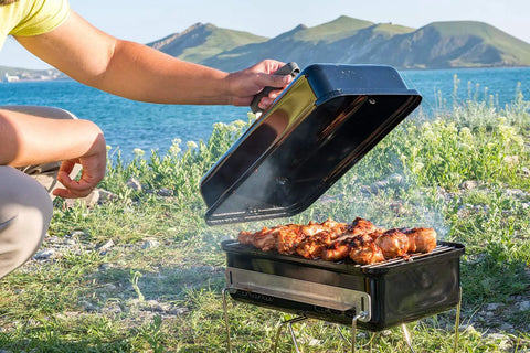 Game Changing Stainless Steel Cooking Grate And Flavorizer Bar Combo Kit Replacement For Weber Go Anywhere Portable Gas Charcoal Grill in use outdoors.