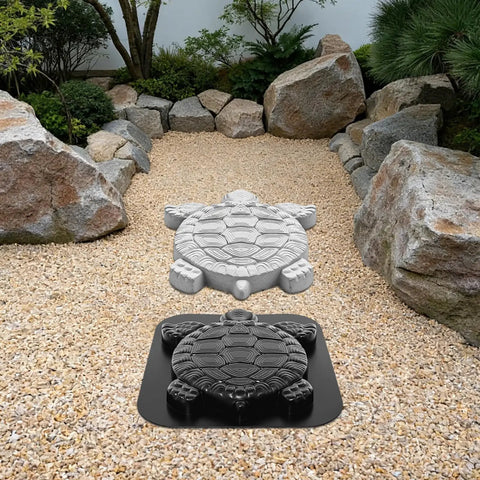 Turtle Shaped Paving Mold For DIY Stepping Stones And Garden Pathways Concrete Cement Mould Reusable Stamp For Patio Sidewalk 17.3 By 15 Inches Easy To Use Fun Backyard Project placed on a gravel path in an outdoor garden setting.