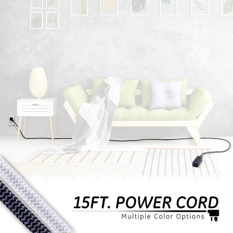 15 ft power cord connecting to a green sofa in a living room. 3 Outlet Power Strip With 15 Ft Braided Cord Flat Plug 250 Joules.
