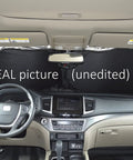 Interior view showing Retractable Windshield Sun Shade With Storage Pouch For Cars Trucks And SUVs Front Window Shield Blocker.