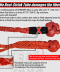 Diagram showing orange synthetic soft shackle with warning on heat-shrink tube, damaging UHMWPE fiber, off-road recovery gear.