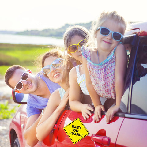 Family in car with Baby On Board Car Magnet Sign 2 Pack 5x5 Inches Bright Yellow Reflective Safety Sticker on door.