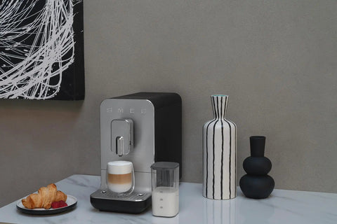No Sweat Brewing Fully Automatic Espresso Machine With Integrated Grinder And One Touch Milk Frother For Silky Lattes Bold Shots And Ten One Tap Presets 19 Bar Pressure Compact Space Saving Matte Black on a marble surface.