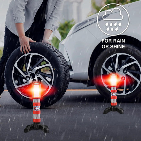 LED Road Flares For Vehicles With Three Alert Modes Flashing Red Solid Red And White Flashlight set up by car tire in rain