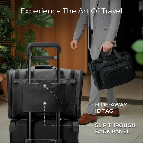 Man holding black underseat duffle bag for travel lightweight carry on personal item that fits under airplane seat weekender luggage.