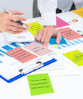 Bright Lined Sticky Notes 4x6 Inches Pack Of 15 With 7 Bold Colors Self Stick Notes on office desk during meeting.