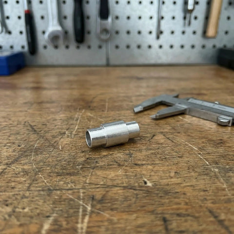 16 Piece Long Bearing Spacers Roller Skate Axle Sleeve Kit Shields Protect Inline Gear Dustproof Design Kept Fresh Easy Install Top Tier Ultimate Quality Helps Cruisers Run Super Smooth Any Time You Ride Crush The Streets Everywhere You Go. aluminum axle sleeve on workbench