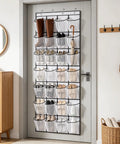 Over The Door Shoe Rack With 28 Spacious Pockets For Max Storage Capacity Breathable Mesh Hanging Shoe Organizer mounted over a door.