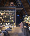 Cozy attic with Wood Peel And Stick Budget Friendly Dope Walnut Grain Texture Wallpaper, showcasing rustic interior decor.