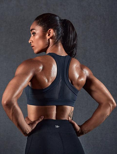 Side view of woman wearing Zip Front High Impact Sports Bra For Gals Plus Size XL Haze Blue Zero Bounce Lockdown Wireless Full Coverage