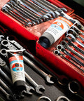 AGS SIL-Glyde 4 oz silicone brake lubricant tubes (2) in a red tool chest with wrenches.