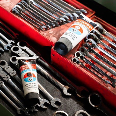 AGS SIL-Glyde 4 oz silicone brake lubricant tubes (2) in a red tool chest with wrenches.