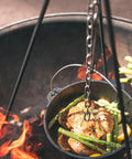Pre Seasoned 2 Qt Cast Iron Dutch Oven With Flat Bottom For Stovetop And Campfire Use over flames cooking chicken and vegetables