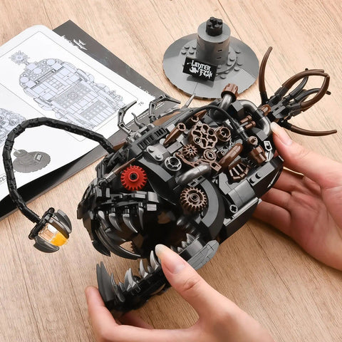 Mechanical Anglerfish Building Kit For Adults With Light Display 1038 Piece Set in hands on desk