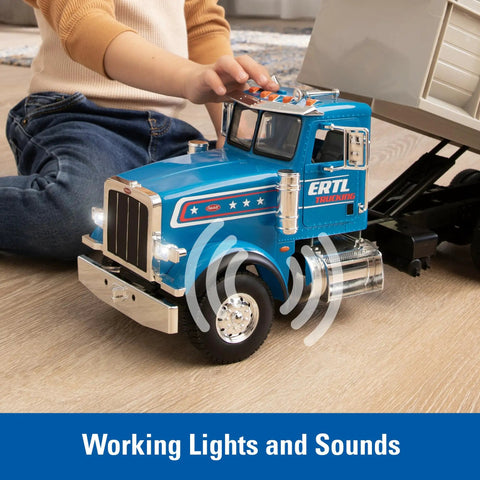 Child playing with Blue Peterbilt 1/16 Scale Dump Truck Toy With Working Dump Bed, showcasing realistic lights and sounds.