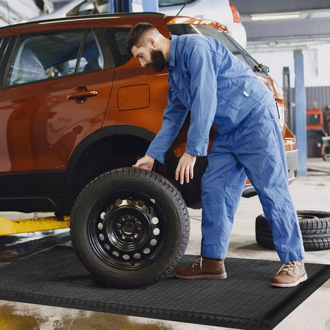 Mechanic standing on Heavy Duty Anti Fatigue Mat Beat Fatigue While Standing All Day Industrial 2 By 5 Feet Ergonomic Shop Mat