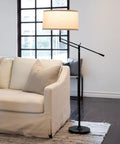 Mid Century Modern Dope Height Adjustable LED Floor Lamp For Living Room Bedroom And Office Decor next to white sofa in living room