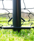 Close-up of Ultimate Baseball Batting Cage System With Durable Frame And Flexible Lengths From 20 Ft To 70 Ft, base anchored in grass