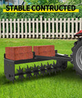 Tow Behind Lawn Aerator 32 Inch Heavy Duty Core Aerator Tool With Universal Hitch attached to tractor on grass