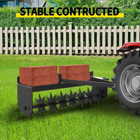 Tow Behind Lawn Aerator 32 Inch Heavy Duty Core Aerator Tool With Universal Hitch attached to tractor on grass