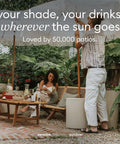 Patio Must Have Weatherproof Umbrella Side Table With Hole Durable Plastic Stone Combo used by people outdoors