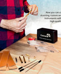 Man assembling 10 Pack Silver Twist Slimline Woodturning Pen Kit Set With Black Ink, parts and box on table.