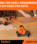 Four Pack Right Angle Woodworking Clamps with Adjustable Jaw in use for 90 degree corners on a wood project, keeping boards flat.
