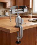 3 Inch Table Vise With Swivel And 360 Degree Tilt, Handy Workhorse Vise clamped on a wooden workbench, cast aluminum, steel jaws