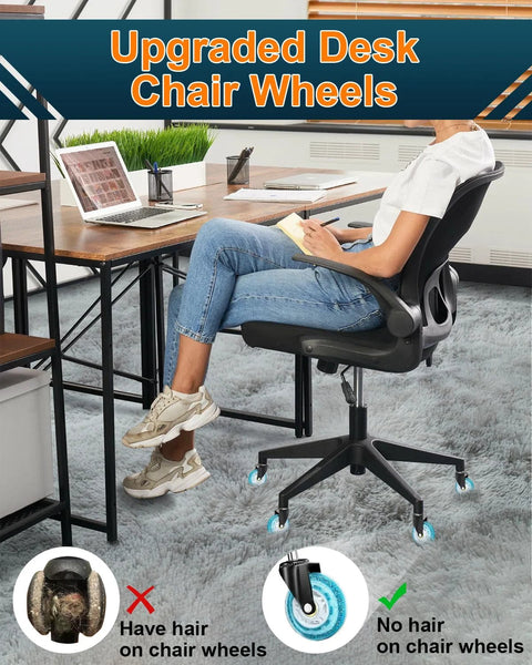 Person sitting on office chair with upgraded desk chair wheels, showing hair-free chair caster wheels on carpeted floor.
