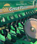 Green drill planter with Two Pack Grain And Drill Seed Tube For Most Drills, 17 Inches Long But Stretch To 24 Inches attached