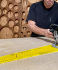Person using Circle Cutter Jig For Routers Delivers Boss Level Precision Cut 184 Perfect Circles on a wooden board