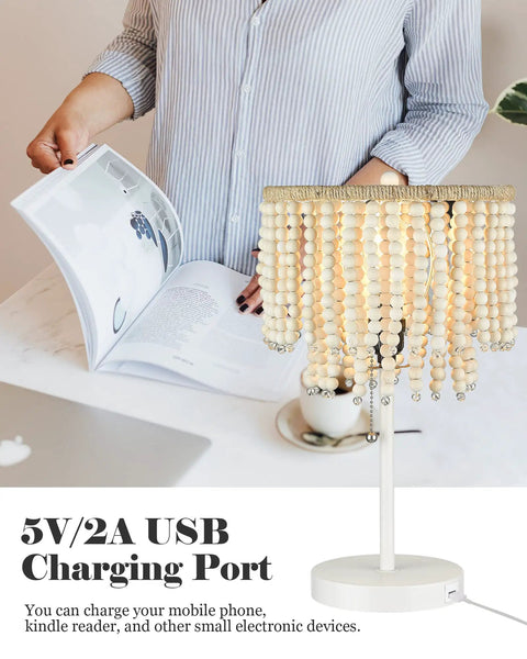 Boho Table Lamp With USB Charging Port and Birch Wood Bead Details on desk with open magazine, cozy white finish, handcrafted beads