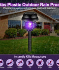 12 Pack Solar Bug Zapper Outdoor Waterproof Mosquito Killer Lamp with purple light, shown in a garden setting during rain