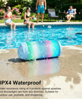 Powerful Portable Wireless Bluetooth Speaker With Stereo Sound LED Lights And Long 36 Hour Battery Life IPX4 Waterproof BT53 TWS Pairing Built In Mic Ideal For Outdoors Home Parties And Travel Powder Blue Gift with LED lights by a pool.