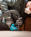 Worker using 18V LXT Brushless Cordless 3 Inch Cut Off Tool, Tool Only With One Hand Operation on wood surface, 20,000 RPM.