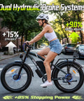 A woman riding the Hella Powerful 8000W Dual Motor Electric Bike For Adults in city, showcasing dual hydraulic brake systems.