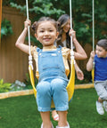 Kids enjoying Weatherproof Wooden Swing Set For Backyard With UV And Mold Protection, Durable Pre Treated Lumber.