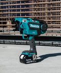 Makita XRT01TK 18V LXT Brushless Cordless Rebar Tying Tool Kit With 5.0Ah Battery on a construction site.