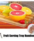 Straight Ahead Stainless Steel Tray Handles Set Of 4 With Comfy Angled Grip And Clean Silver Look Great For Kitchen Drawer Upgrades Custom Cutting Boards And Crowd Pleasing Charcuterie Displays with fruit on wooden board.